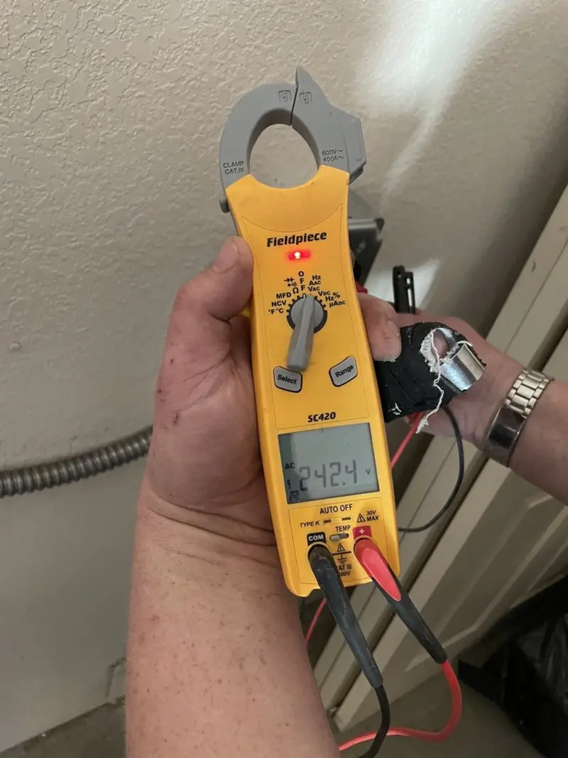 Voltage testing with clamp meter during Aluminum Wiring Replacement in Algoma